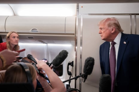 US president Donald Trump speaks with members of the media aboard Air Force One en route from Florida to Joint Base Andrews, Maryland.