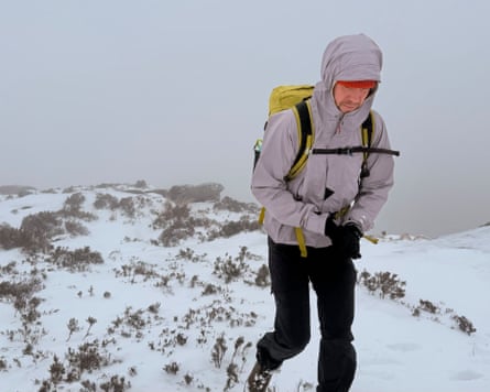 Paddy Maddison testing waterproof jackets on a snowy hike