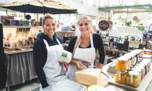 10 of the most effective meals markets in Sweden: anybody for smoked moose meat or cloudberry doughnuts? | Uncover Sweden’s delights 3 Staff at a stall at Kville Saluhall food market