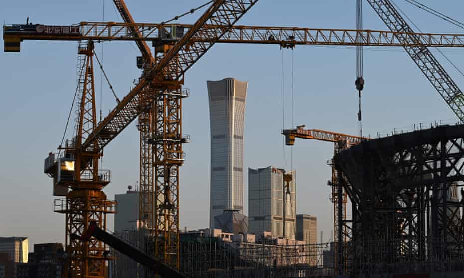 Cranes are seen at the construction site of the new Workers' Stadium, which is being rebuilt on the site of the old Workers' Stadium which was demolished in 2020, in Beijing