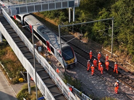 Rail workers pictured at the scene of a Greater Anglia train derailment, south of Wickford railway station in Essex.
