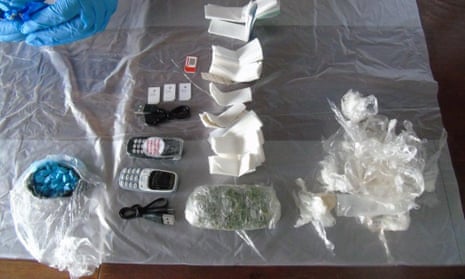 Drugs and mobile phones that were found in dead rats