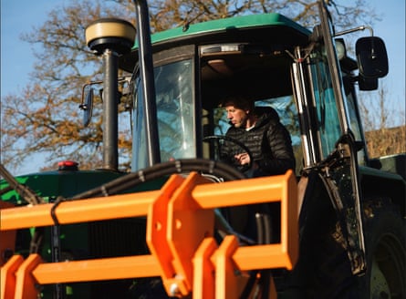 Cato in a tractor.