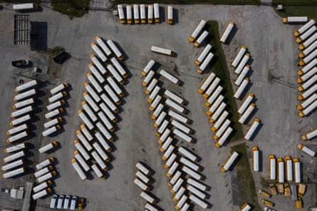 Empty school buses in parking lot in Houston, Texas this July.