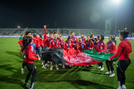 Afghan Women United cheer after their match with Libya
