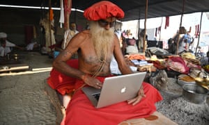 Magh Mela, India
A sadhu works on a laptop at Sangam during the ongoing Magh Mela Festival in Prayagraj.