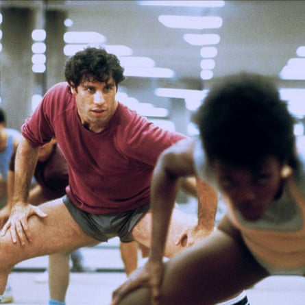 John Travolta, wearing short shorts, in a gym scene in the movie Perfect, released in 1985.