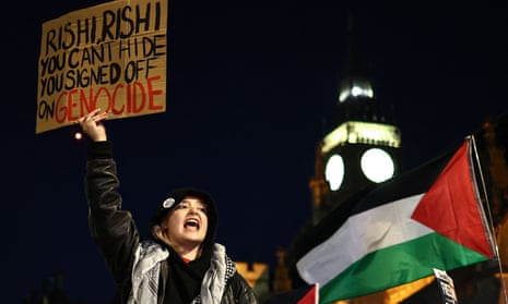 A protester holds a placard and chants slogans during a rally in support of Palestinians, outside of the Houses of Parliament in central London on November 15, 2023, to demand Members of Parliament vote for a ceasefire in Gaza.