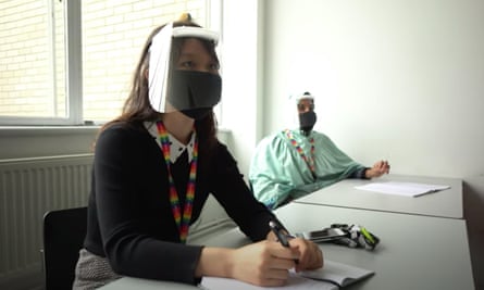 A still from a Bristol university promotional video, showing a student wearing a face masks and a visor to protect from coronavirus.