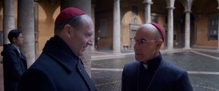 Fiennes as Cardinal Lawrence and Tucci as Cardinal Bellini in the movie.
