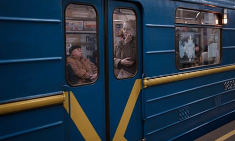 A woman travelling in a subway in Kyiv.