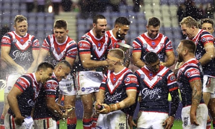 Sydney Roosters’ Boyd Cordner (centre left) and team-mates celebrate with the trophy after winning the World Club Challenge.