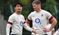 Owen Farrell and Marcus Smith look on during a training session