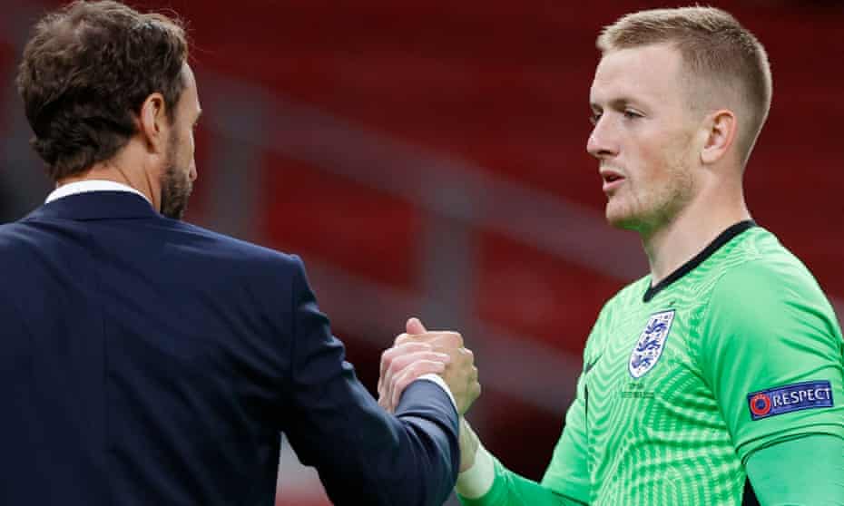 England manager Gareth Southgate shakes hands with Jordan Pickford