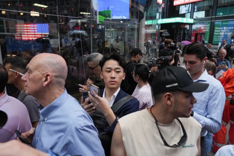 People gather outside on the day of SpaceX's initial public offering (IPO) at the Nasdaq MarketSite in New York City, U.S., June 12, 2026. REUTERS/David Dee Delgado