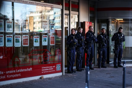 Police officers outside the robbed branch Sparkasse