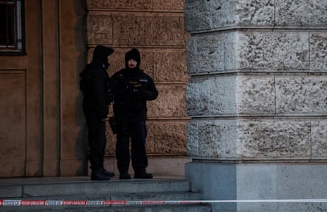 Members of the Police stand guard following a shooting at one of Charles University's buildings in Prague, Czech Republic, December 22, 2023.