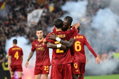 Paulo Dybala of Rome celebrates with his teammate Tammy Abraham after scoring the opening goal during the Europa League final between Seviila and Roma.