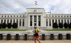 FILE PHOTO: A jogger runs past the Federal Reserve building in Washington, DC, U.S., August 22, 2018. REUTERS/Chris Wattie/File Photo