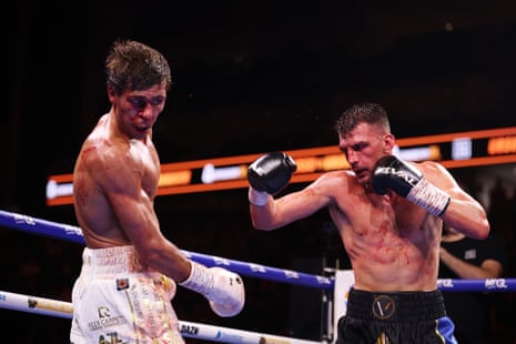 Ben Vaughan (right) lands a punch on Constantin Ursu during their British and Commonwealth welterweight title fight at the O2 Arena.