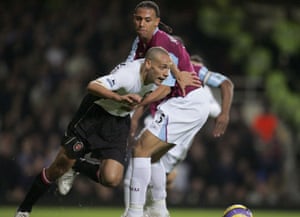Anton Ferdinand tries to halt his brother Rio while playing for West Ham against Manchester United in 2006