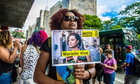 People gather in São Paulo, Brazil on 14 April 2018 to mark Marielle Franco’s murder. Her killing remains unsolved. 