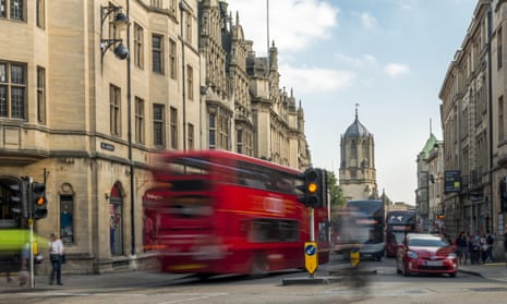 A bus crosses Carfax, a busy road junction in Oxford.