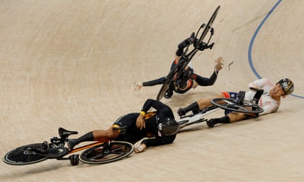 Britain’s Jack Carlin (top) crashes on the home straight with Muhammad Shah Firdaus Sahrom of Malaysia (left) and Shinji Nakano of Japan (right) in the final of the men’s keirin.