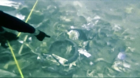Divers search for black boxes in debris of Sriwijaya Air crash – video