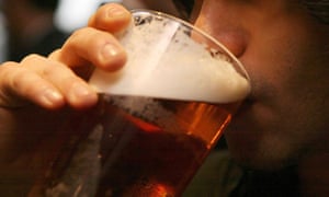 Man drinking pint of beer