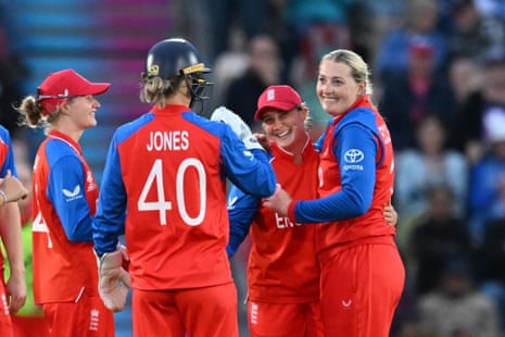 Sophie Ecclestone of England (right) celebrates taking the wicket of Cara Murray of Ireland with Alice Capsey (second right) and teammates.