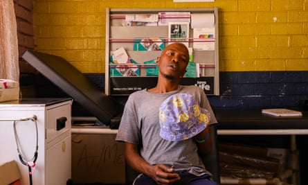 A young black man in a grey T-shirt