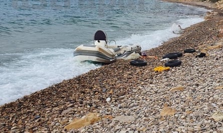 A refugee boat washed up on the beach on Chios, Greece.