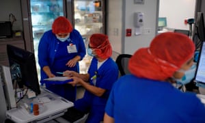 Healthcare workers in the ICU at Oakbend Medical Center in Richmond, Texas, on 15 July 2020. The death toll for US healthcare workers continues to mount.