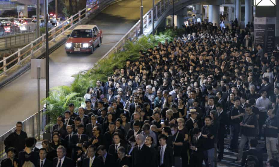 Lawyers take part in a silent protest march through downtown Hong Kong.