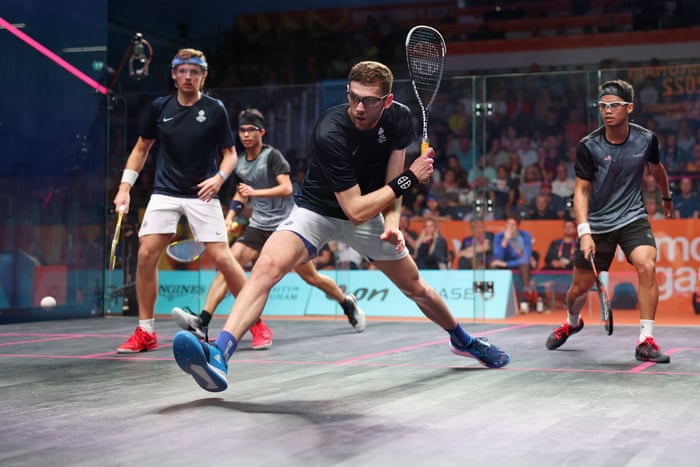 Eain Yow Ng (R) and Chee Wern Yuen (second from left) of Malaysia compete with Greg Lobban (L) and Rory Stewart (second from right) of Scotland.