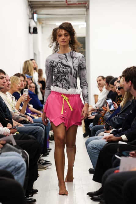 A model walks down the catwalk wearing an outfit by designer Alix Higgins