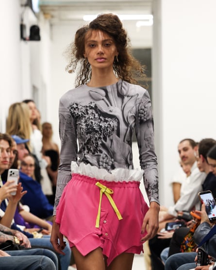 A model walks down the catwalk wearing an outfit by designer Alix Higgins