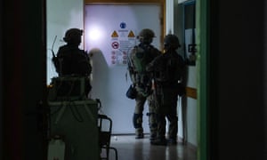 This handout picture reportedly shows Israeli soldiers carrying out operations inside al-Shifa hospital in Gaza City