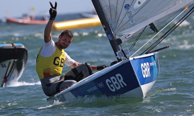 Giles Scott celebrates winning gold in the men’s Finn