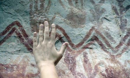 There are numerous hand prints among the images on the cliff face, similar to these at the nearby site of Cerro Azul.