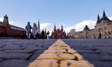 People walk in Red Square, Moscow, late last month.
