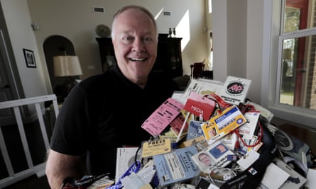 Veteran Associated Press reporter Michael Graczyk poses with some of many media credentials he has collected over his career