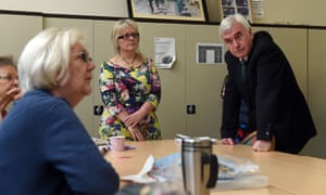 John McDonnell listens Ann Caswell at a Coventry drop-in centre.