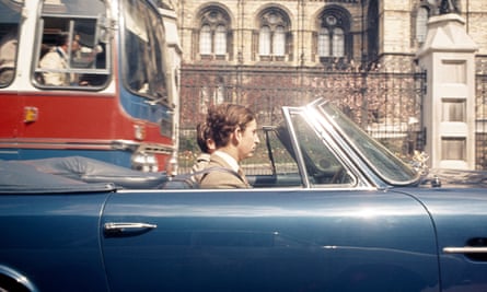 The Prince of Wales driving his Aston Martin in Kensington, London, in 1971.