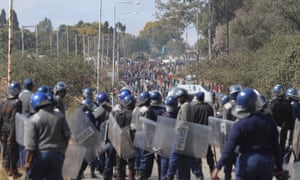 Police clash with rioters in Harare