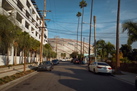 A multistory building pinch a domed building astatine nan extremity of nan street.