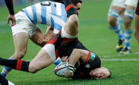 Mike Brown crashes his head into the turf after a dangerous tackle from Joaquin Tuculet who got a yellow card during the England v Argentina autumn international rugby union match at Twickenham