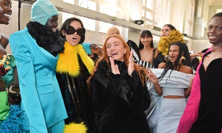 Harris Reed, centre, backstage with models at his Nina Ricci show in Paris.