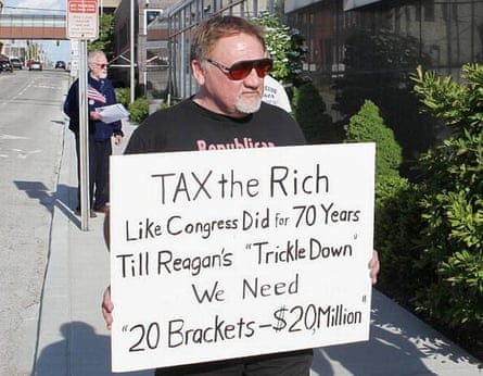In this undated file photo, James Hodgkinson holds a sign during a protest outside of a United States Post Office in Belleville, Illinois.